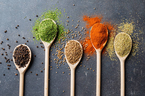 istock Herbs and spices on gray stone table 617565468