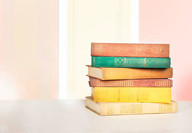 istock Colorful books on a wooden table. 617565558