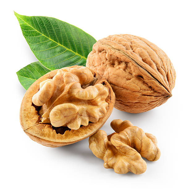 istock Walnuts with leaves in closeup. With clipping path. 617566422