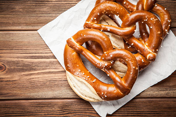 istock Pretzels on wooden table 617567344