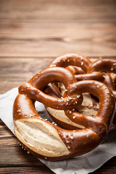 istock Pretzels on wooden table 617567450