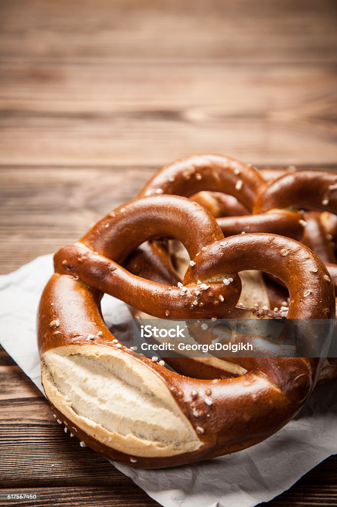 Pretzels on wooden table Traditional german pretzels on wooden table Pretzel Stock Photo