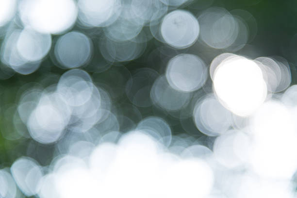 Green and White bokeh circles abstract background. stock photo