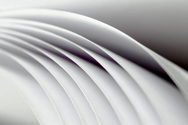 istock curved sheets of white paper 617569296