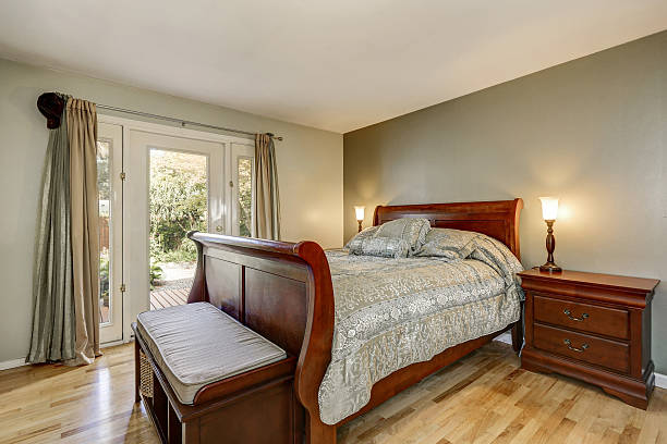 istock Simple yet luxurious man's bedroom with solid wood furniture 617570432