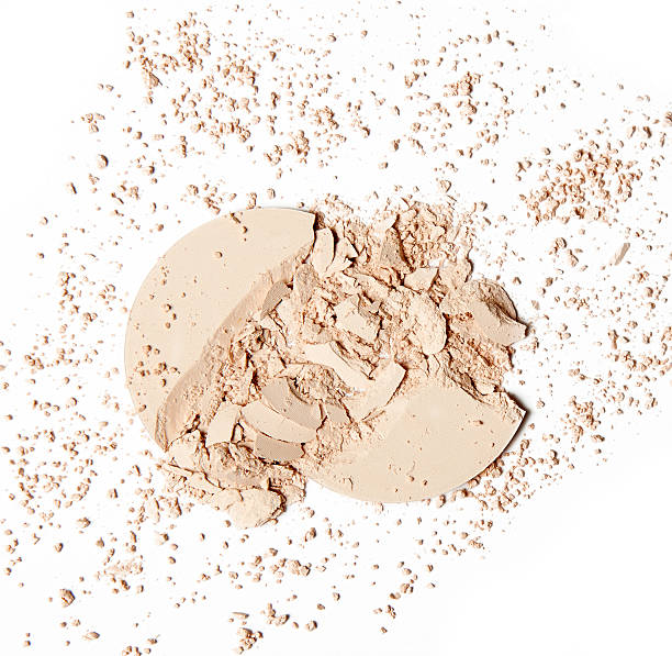 istock crumbled beige powder on white background 617571038