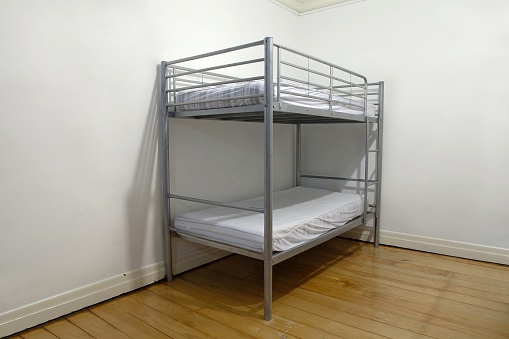 Simple bunk bed in the corner of a room