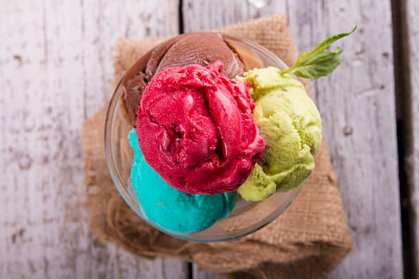 istock Ice cream in glass cup on a wooden table 617574936