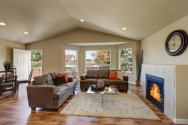 istock Vaulted ceiling living room with large windows 617577176