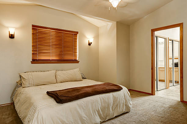 istock Light tones bedroom interior with carpet floor 617579576