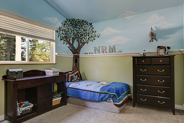 istock Kid's bedroom with blue sky painted walls 617579712
