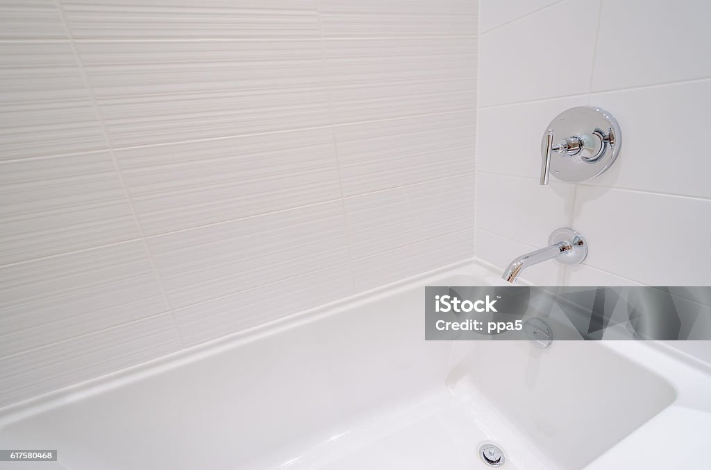 Fragment of a luxury bathroom with a detail of bathtub. Bathtub Stock Photo
