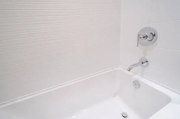 Photo of Fragment of a luxury bathroom with a detail of bathtub.