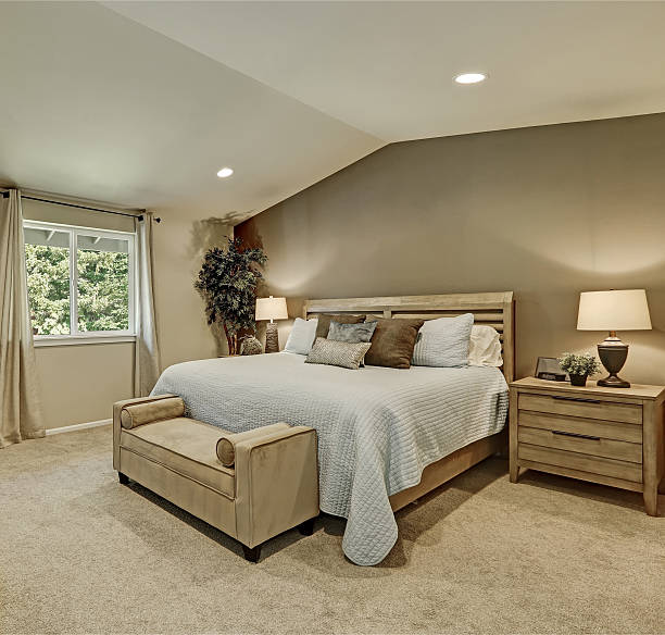 istock Elegant beige and brown bedroom interior with pale blue bedding 617581340