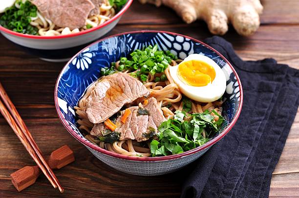 istock Soup with soba and ramen noodles, beef, ginger, green onions 617581440