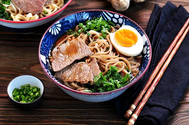 istock Soup with soba and ramen noodles, beef, ginger, green onions 617581708
