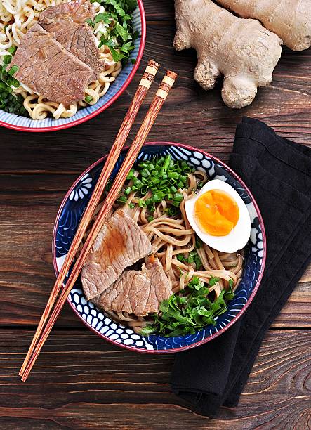 istock Soup with soba and ramen noodles, beef, ginger, green onions 617581872