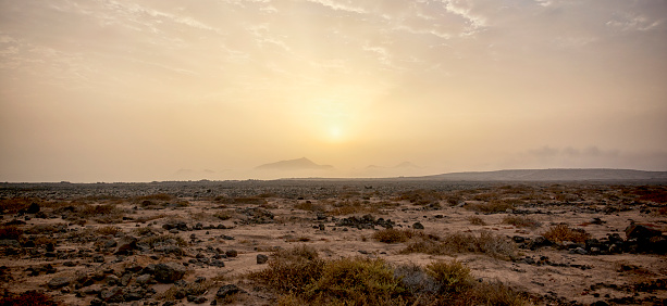 Sunrise ove the arid desert sands of Playa Blanca