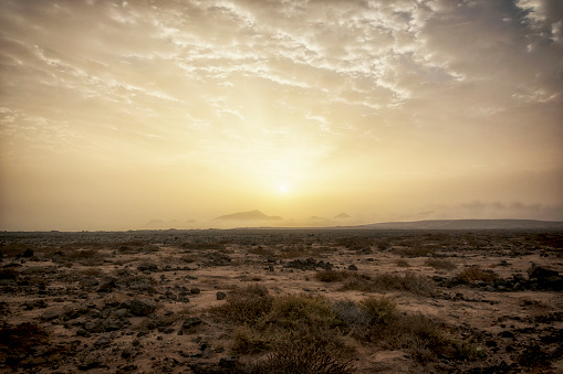 Sunrise ove the arid desert sands of Playa Blanca