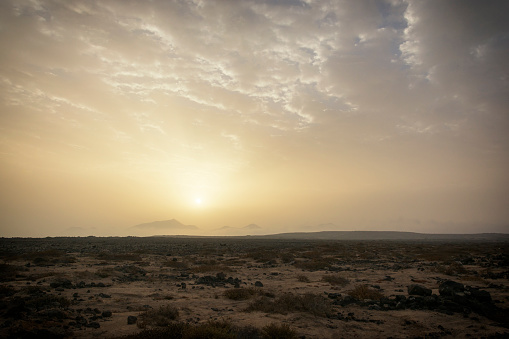 Sunrise ove the arid desert sands of Playa Blanca