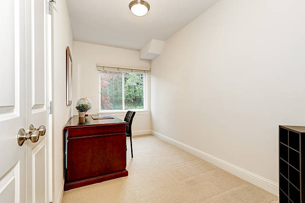 istock White interior of home office with burgundy desk 617584228