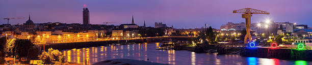 Sunrise in Nantes - panoramic view of the city Sunrise in Nantes - panoramic view of the city. Nantes, Pays de la Loire, France nantes stock pictures, royalty-free photos & images