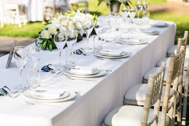istock Wedding table decorations. Flowers plates utensils 617585830