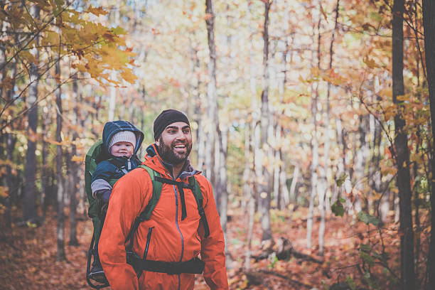 istock Father Backpacking Hiking with Baby in Forest 617586400