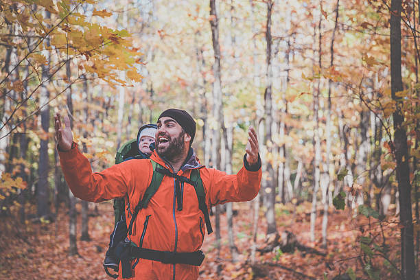 istock Father Backpacking Hiking with Baby in Forest 617586616