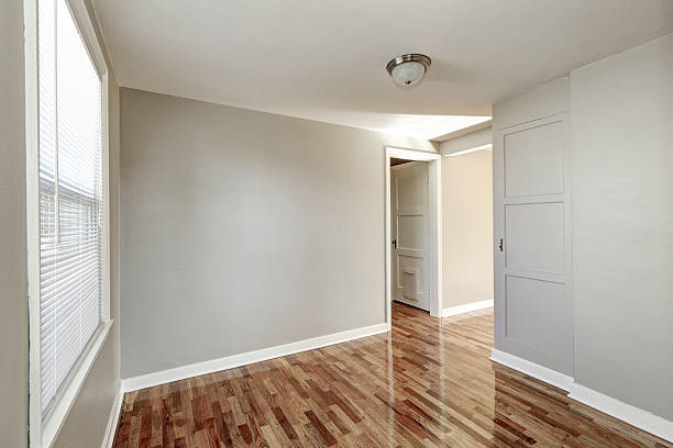 istock Empty beige hallway interior and hardwood floor 617586798