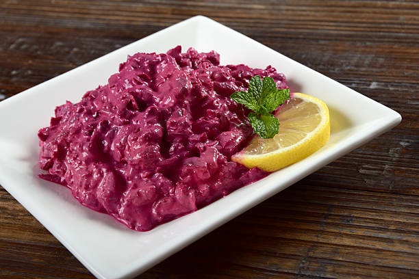 Greek or Turkish Tzatziki dip, also called Cacik, made with garlic, yogurt and red beets.
