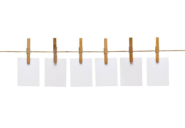 istock clothes peg and note paper on clothes line rope 617586858