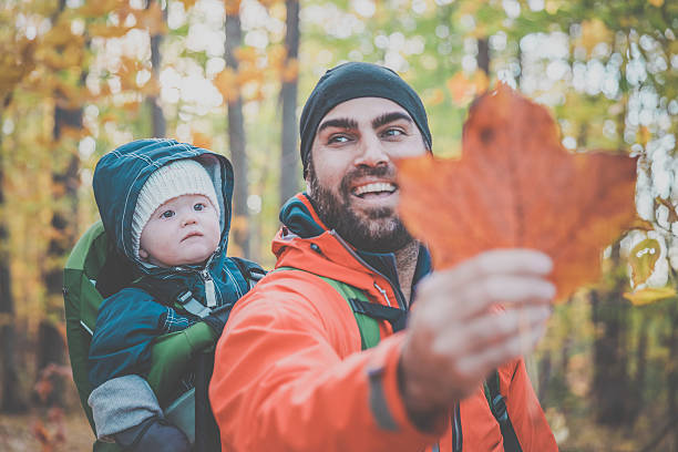 istock Father Backpacking Hiking with Baby in Forest 617586936
