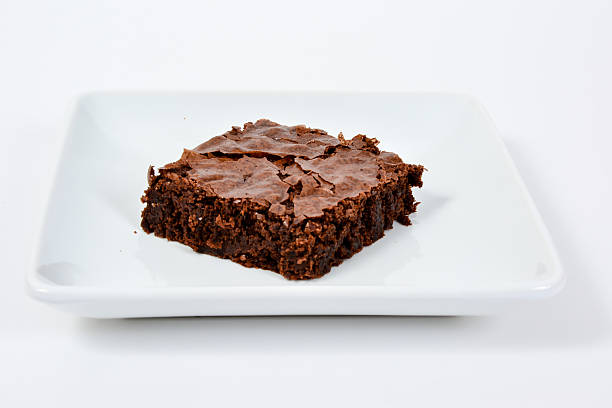 istock Chocolate Brownie on White Plate 617587116