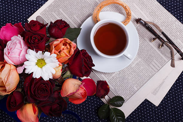istock Beautiful bouquet and cup of tea 617587538