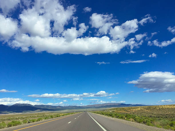 istock Empty road by the fieid and mountain. Landscape. 617587706