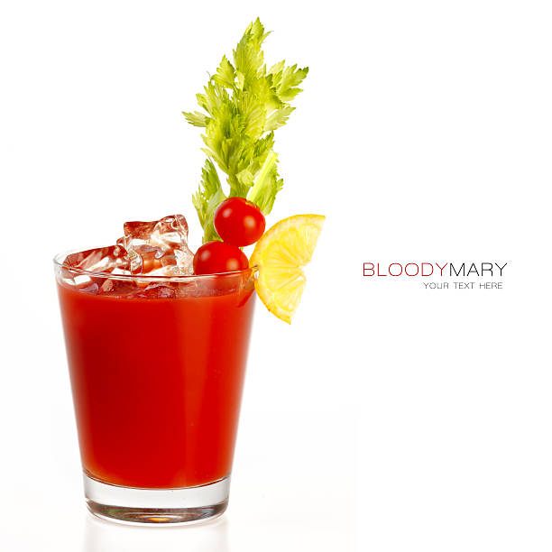 Bloody mary cocktail Bloody mary cocktail made with delicious fresh tomato juice and served in a glass with ice cubes, a celery stick and garnished with a slice of lemon and cherry tomatoes. isolated on white with copy space for text bloody mary stock pictures, royalty-free photos & images