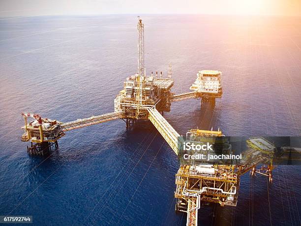 Rigs Offshore Oil Refinery Stock Photo - Download Image Now - Accidents and Disasters, Air Pollution, Business