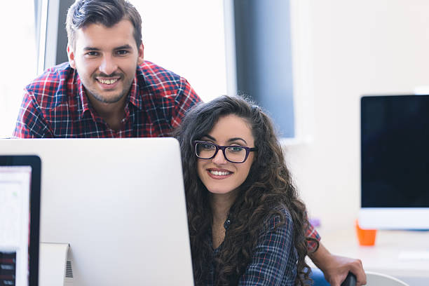 istock business couple working together on project at modern startup office 617593286