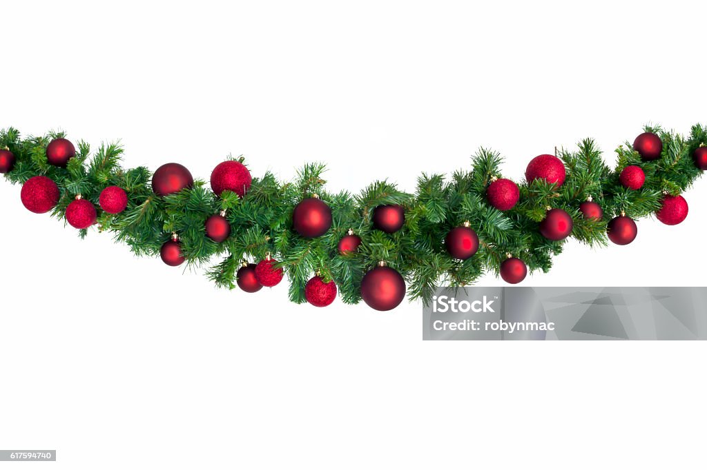 Christmas Garland with Red Baubles Christmas garland with red baubles.  Isolated on white. Garland - Decoration Stock Photo