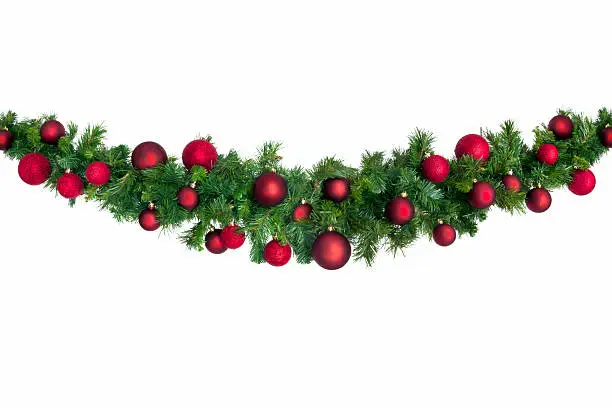Christmas garland with red baubles.  Isolated on white.