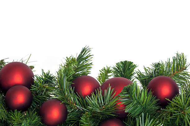 Christmas garland with red baubles.  Border over white background.