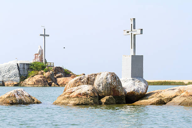 The christian crosses and monuments on the small rock islands in Kerala backwaters, southern India. On the left -  Lamentation of Christ monument.