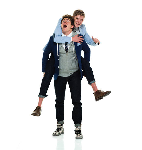 istock Cheerful brothers doing piggyback 617596300