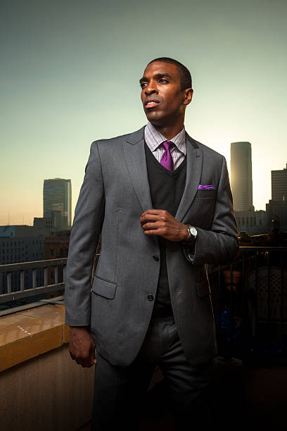 istock Black Businessman with Urban Skyline in Background 617597628