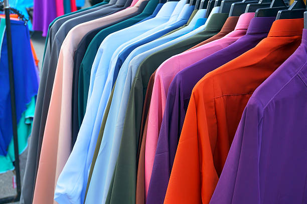 istock row of colorful row shirts hanging on 617599214