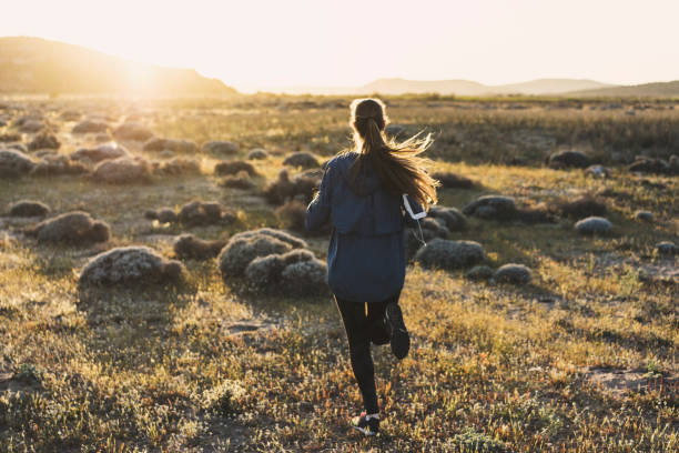 istock Young woman jogging on a sunny day 617599358
