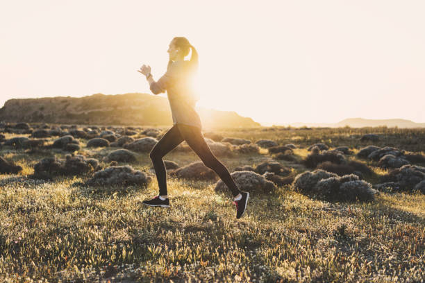 istock Young woman jogging on a sunny day 617599788