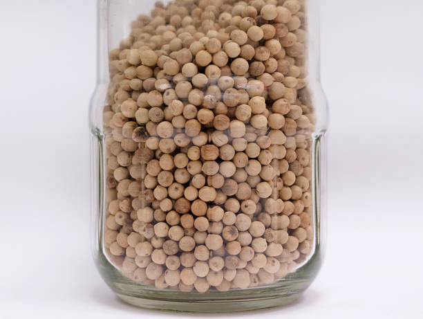 Salt and pepper in a glass container with a grinder, salt shaker, pepper shaker, salt shaker, pepper shaker,