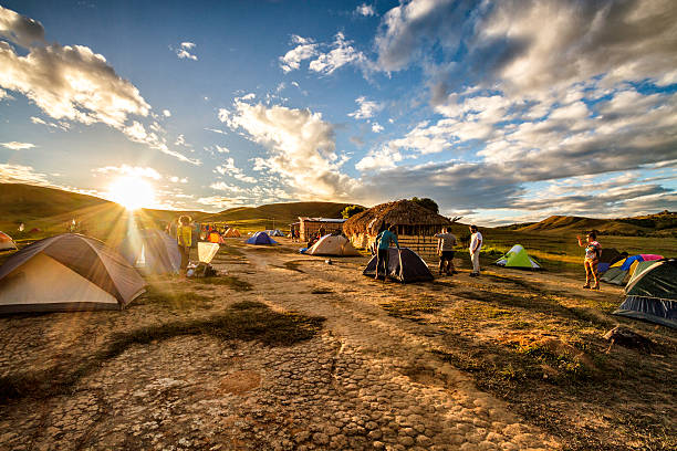 Camping site at Tek River La Gran Sabana Venezuela La Gran Sabana, Venezuela - January 4, 2014: Camping site at Tek River La Gran Sabana Venezuela. This is the campsite located on the river on the Tek river. People getting ready to continue the last walk day before reaching the base ot the Roraima tepuy. This trail is a very popular trek for local and international visitors looking for adventure in la Gran Sabana. mount roraima south america stock pictures, royalty-free photos & images